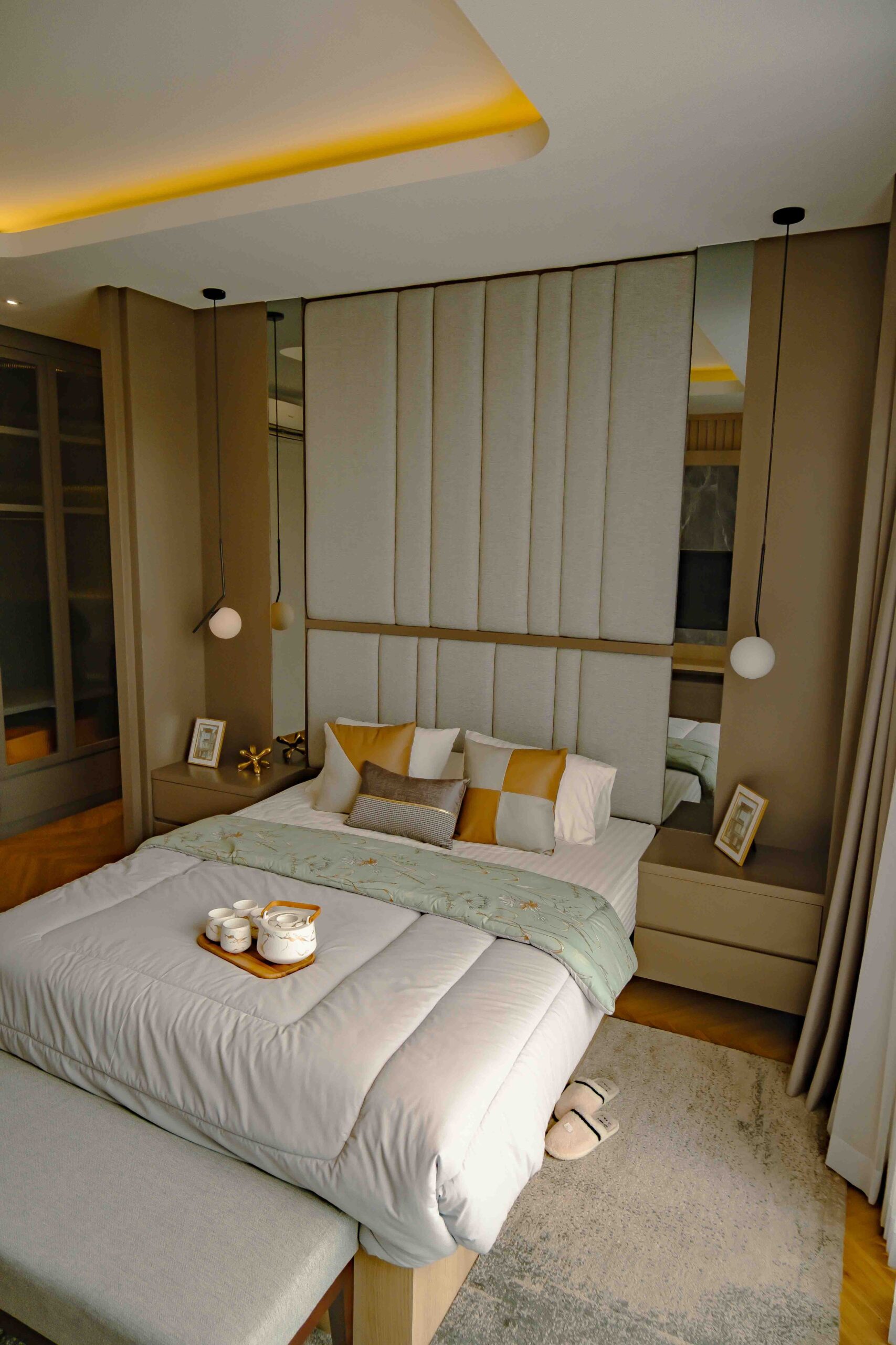Home A stylish, comfortable bedroom with modern design elements and cozy ambiance.