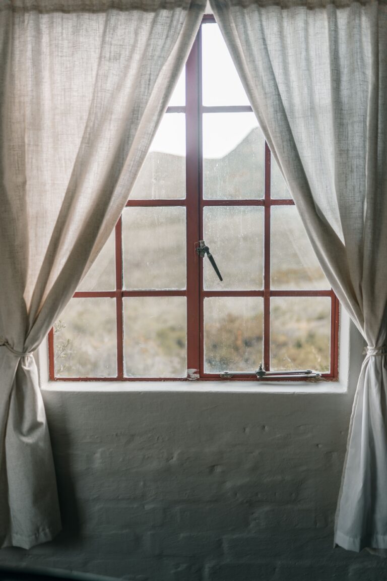 Home Soft-light interior showing serene landscape through framed window.